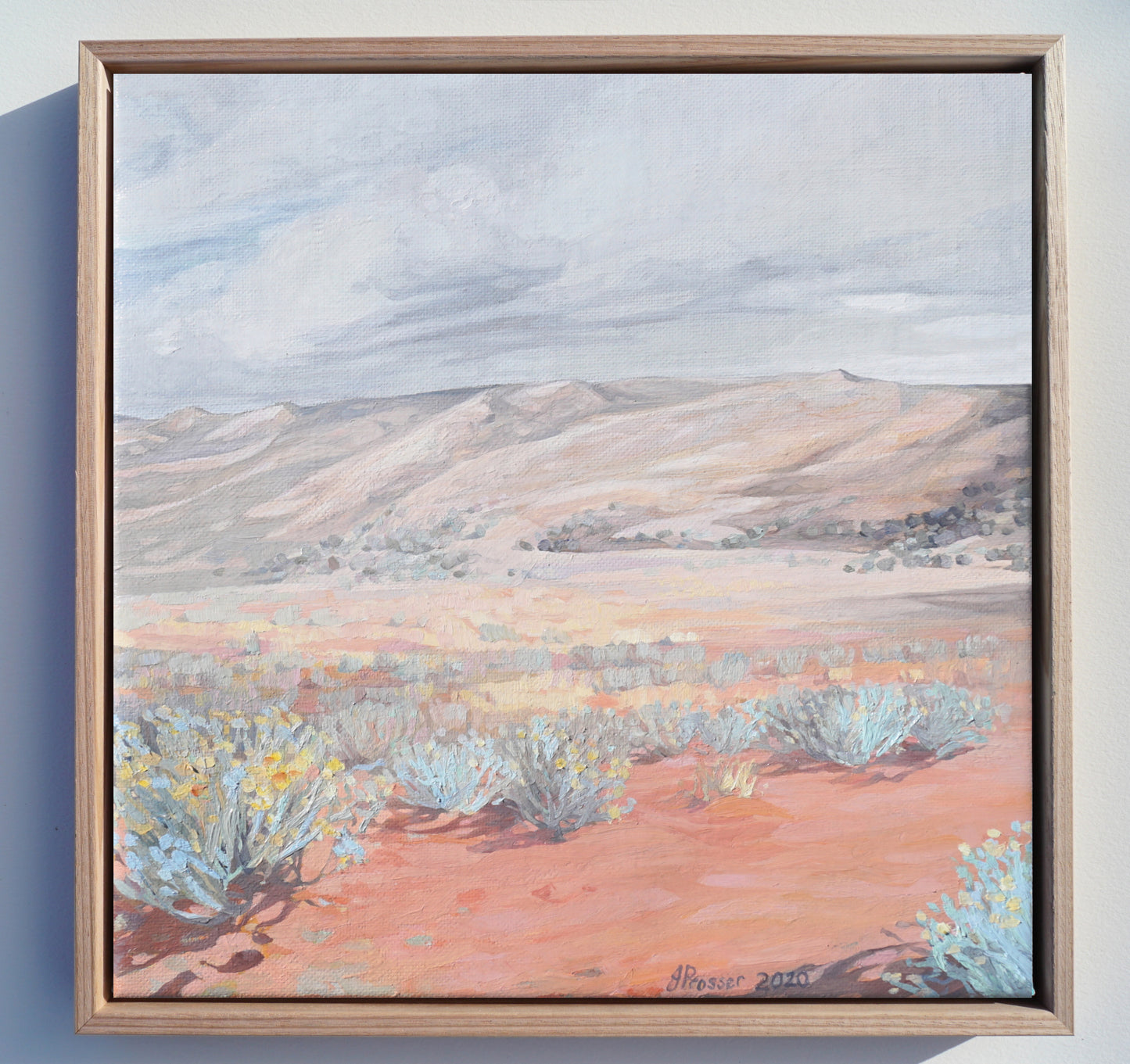 Australian artist Jaime Prosser painting titled 'Desert & Blue Bush Landscape'